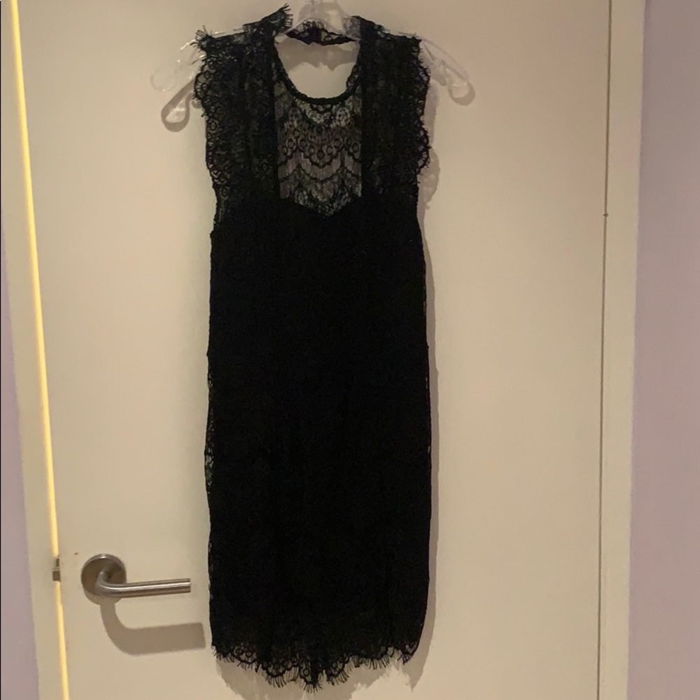 Never worn. Small. Lace dress backless high neck.